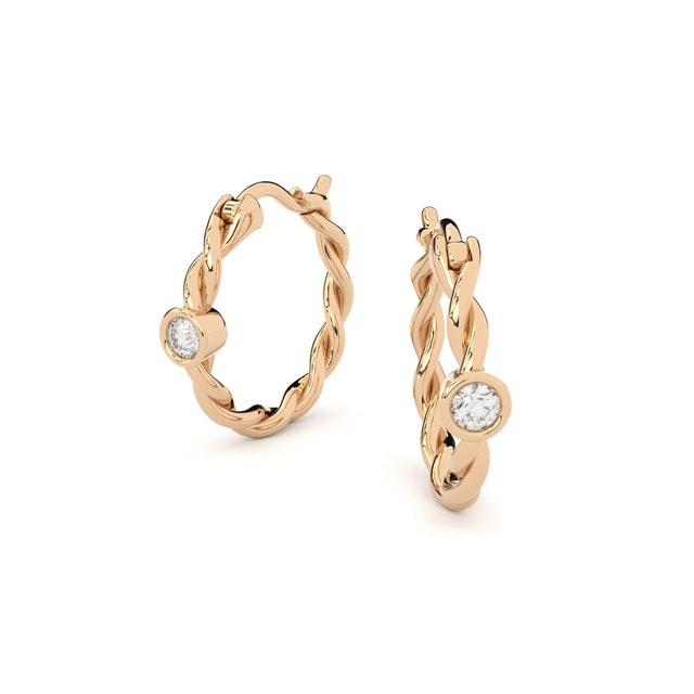 twisted golden hoop earrings with diamonds
