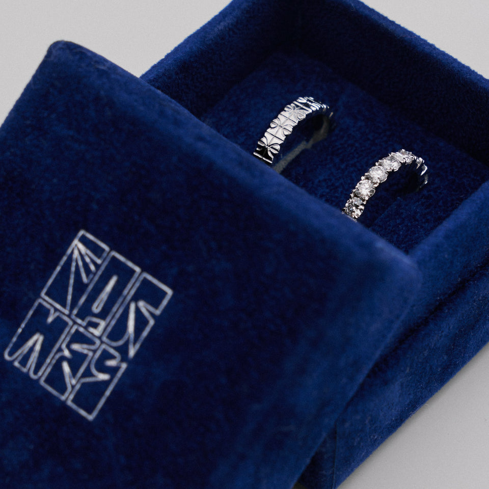 wedding rings in branded box by Formes Fine Jewelry