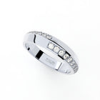 Tiny Clash edgy wedding ring with a distorted diamonds line