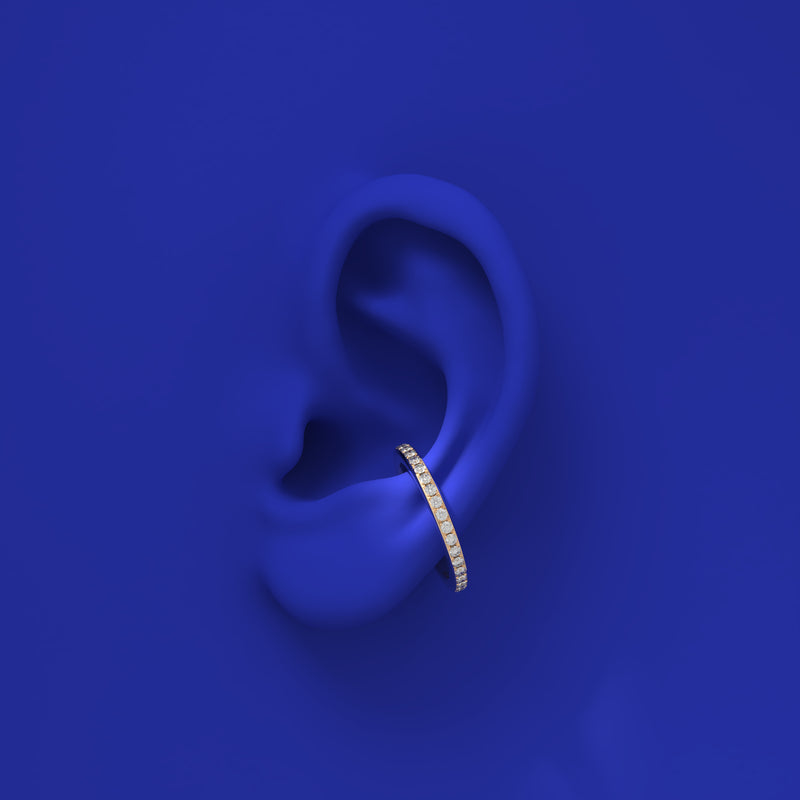 modern ear cuff and ring in one with diamonds in gold by formes on ear
