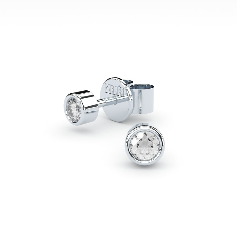 bezel set diamonds studs by Formes