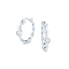 twisted golden hoop earrings with  diamonds