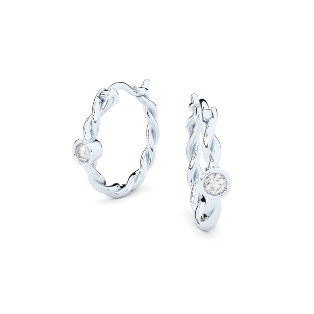 twisted golden hoop earrings with  diamonds